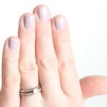 Nails painted with a natural nail polish.