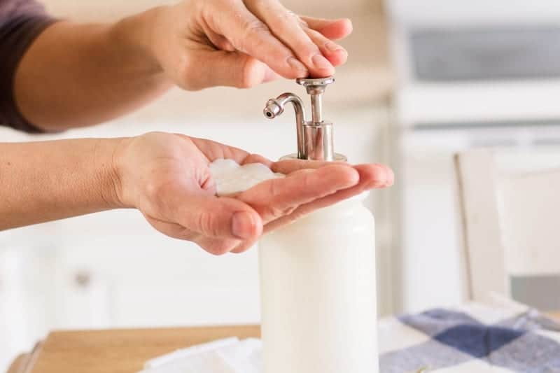 Pumping homemade goats milk lotion out of lotion dispenser. 