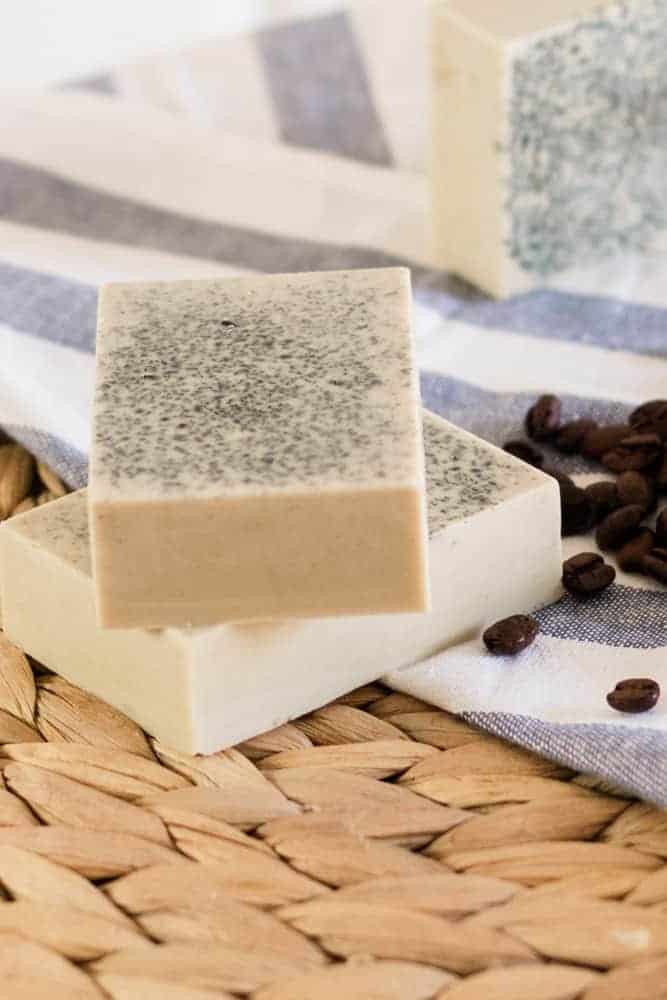 Coffee melt and pour soap bars with coffee beans around them. 