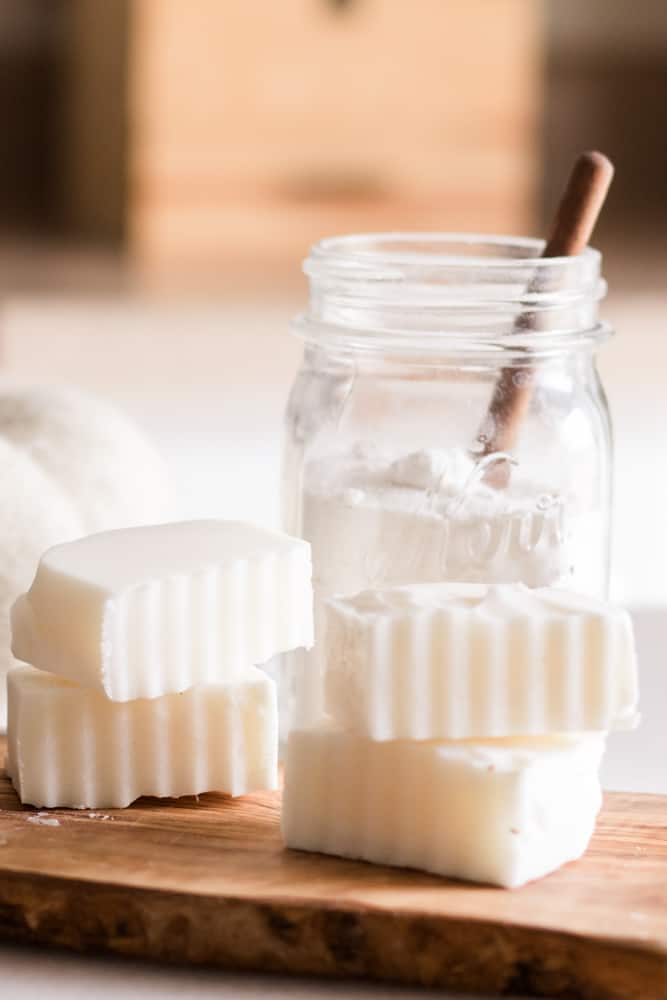 Laundry soap bar on wood cutting board. 