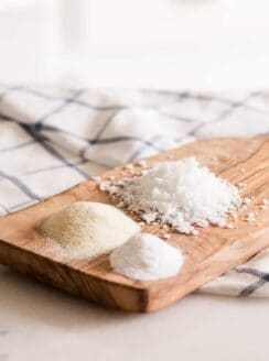 Natural emulsifier powders on wooden cutting board.