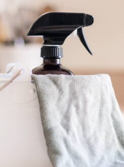 homemade dusting spray in white pail.