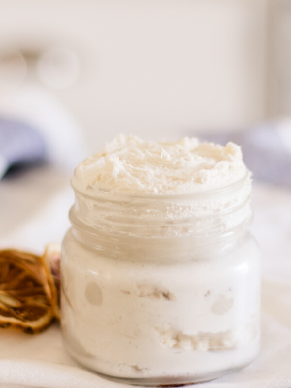 Homemade hand cream in a small glass jar.