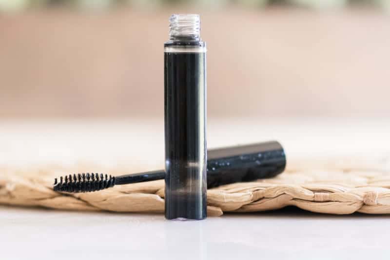 Tube of homemade mascara on table. 