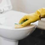 Homemade toilet cleaner being scrubbed out of on a toilet.