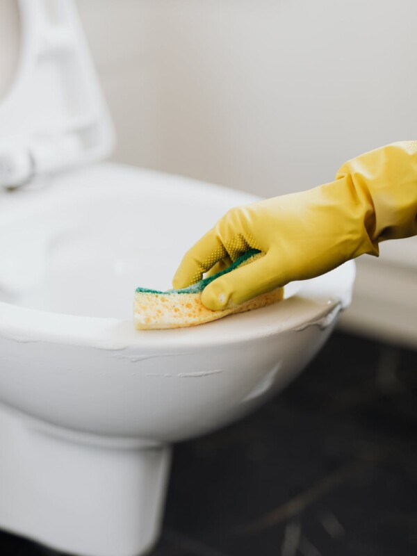 Homemade toilet cleaner being scrubbed out of on a toilet.