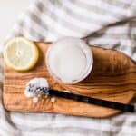 Homemade grout cleaner with a stiff nylon scrubbing brush.