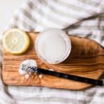 Homemade grout cleaner with a stiff nylon scrubbing brush.