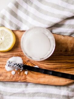 Homemade grout cleaner with a stiff nylon scrubbing brush.