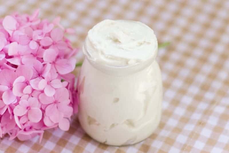 White body butter in glass jar made with tallow. 