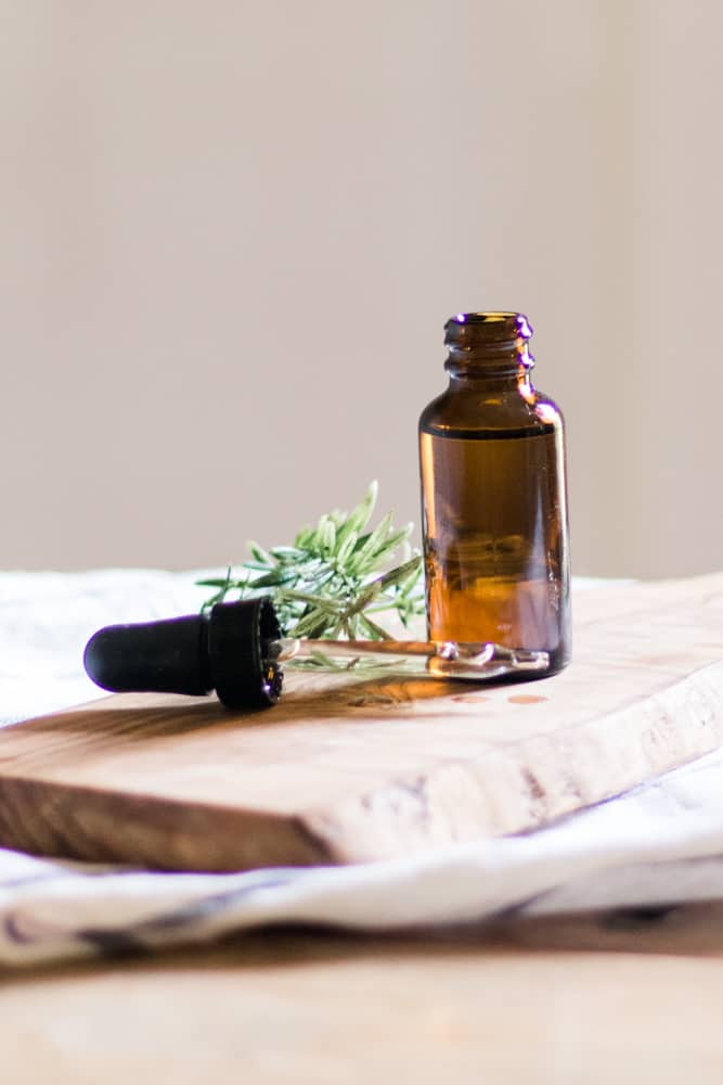 homemade beard growth oil in an amber glass dropper bottle.
