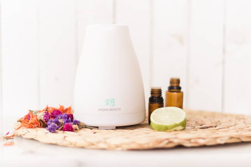 Essential oil diffuser with tropical fruits and dried flowers.
