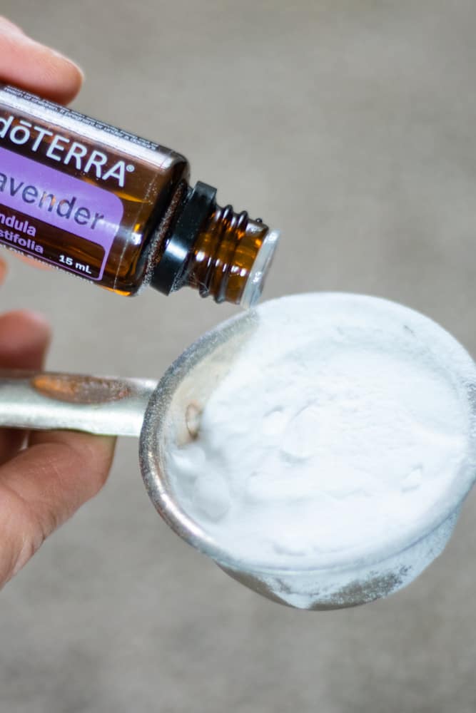 Adding Lavender Essential Oil to baking soda to clean carpet stain.