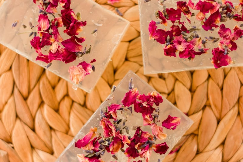 Three translucent glycerin soap bars with florals.