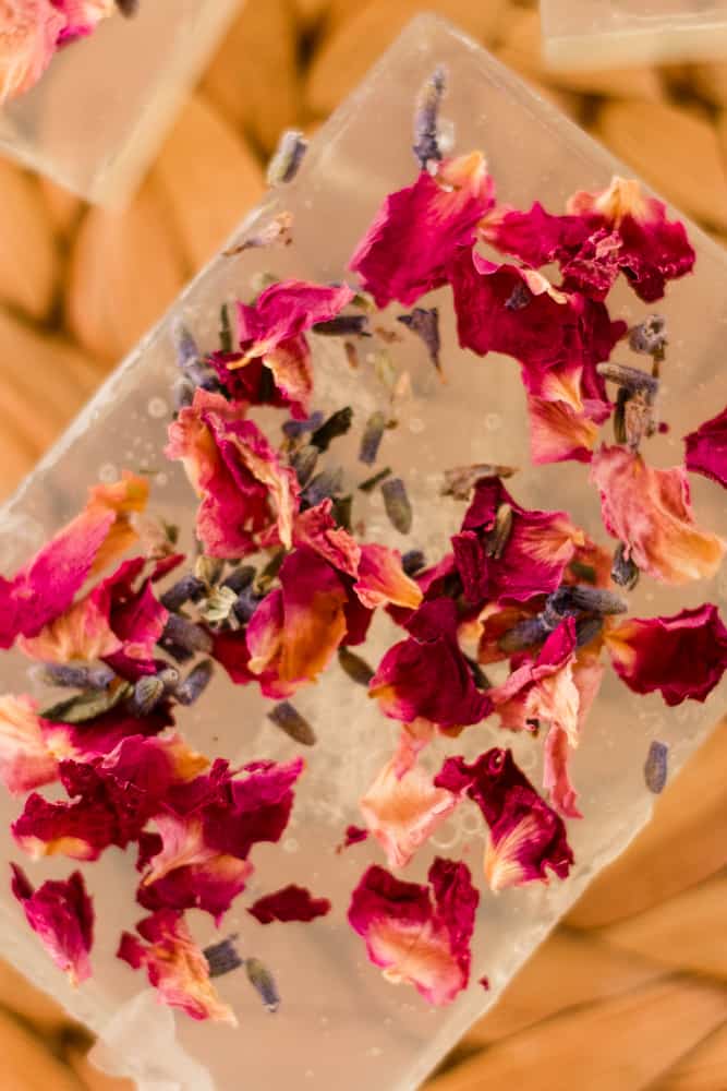 Homemade glycerin soap bar with rose petals.