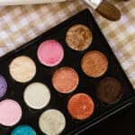 Homemade eye shadow in small plastic palette.