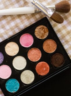 Homemade eye shadow in small plastic palette.