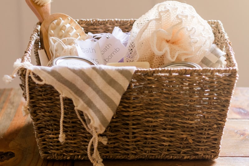 Wicker basket of pamper hamper products.