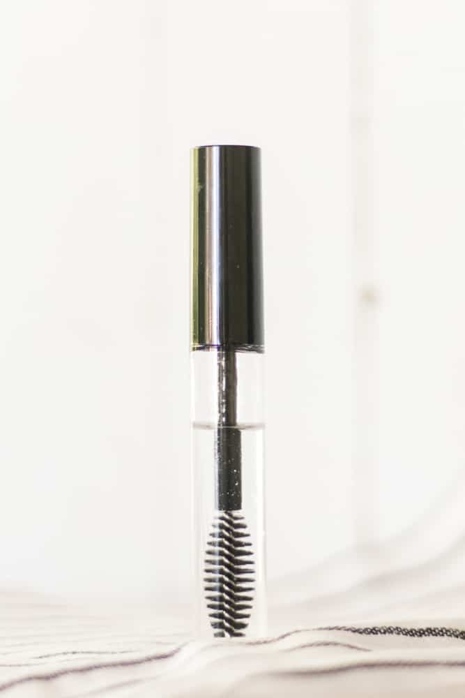 Eyelash serum with castor oil in a mascara tube.