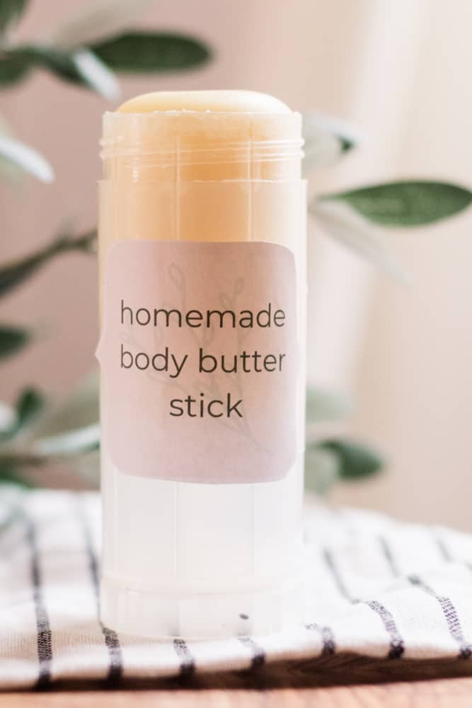 Homemade body butter in clear twist up container.