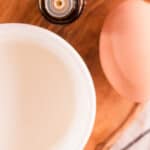 Natural protein treatment for hair ingredients sitting on a blue and white tea towel.