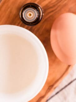 Natural protein treatment for hair ingredients sitting on a blue and white tea towel.