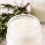 homemade soy candle with rosemary and mint.