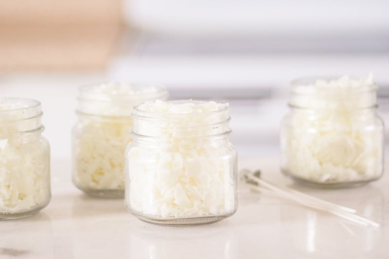 Four mason jars filled with soy wax.