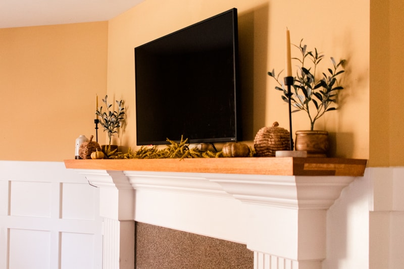 Smart TV hanging above fireplace. 