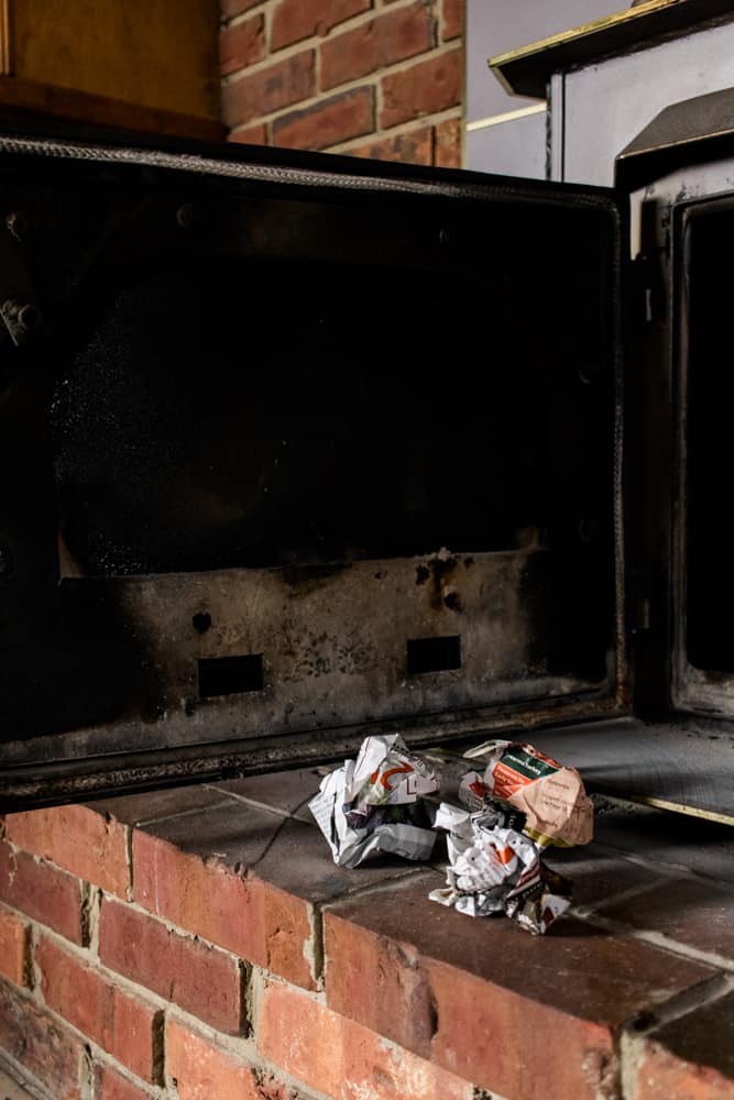 Black glass door on wood burning stove.