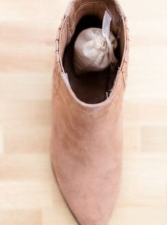 Shoe deodorizer sachet in a leather shoe.