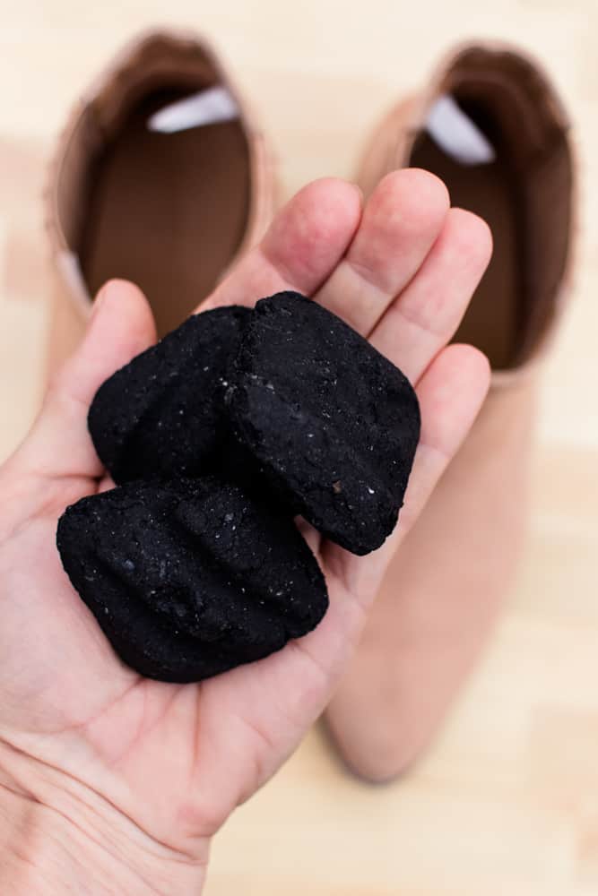 Absorbing shoe odor with charcoal. 
