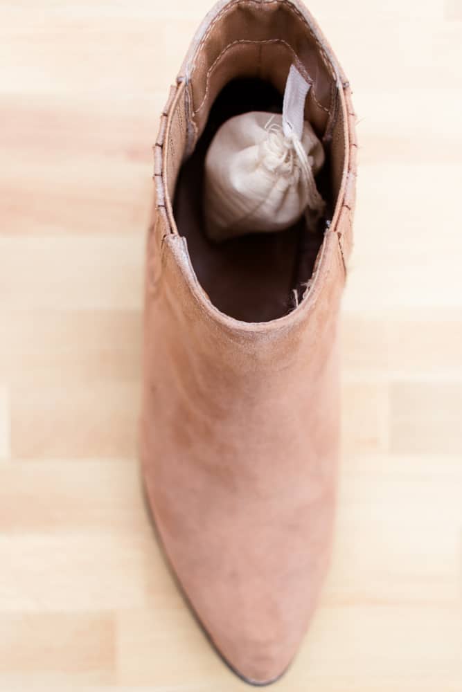 Baking soda shoe deodorizer sachet in the heel of a shoe.