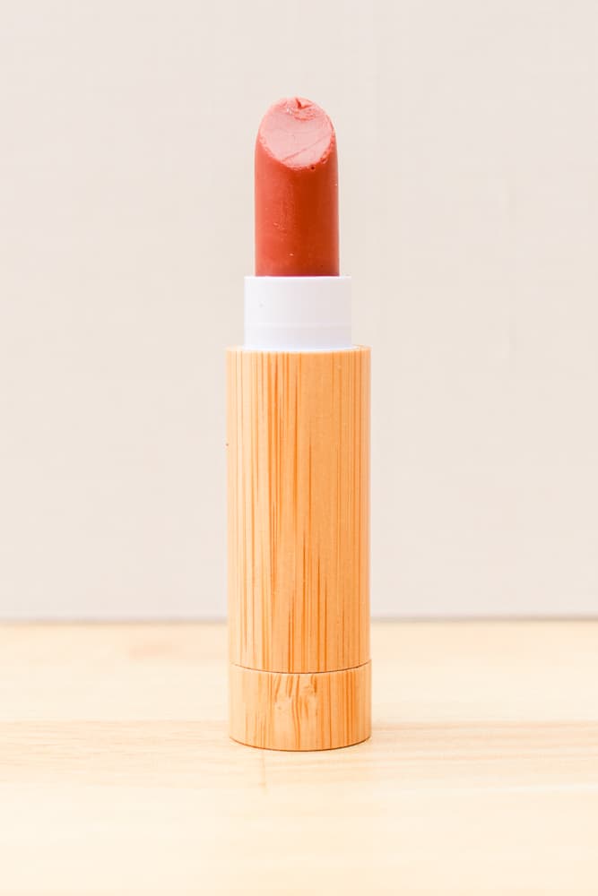Red lipstick in bamboo lipstick tube. 