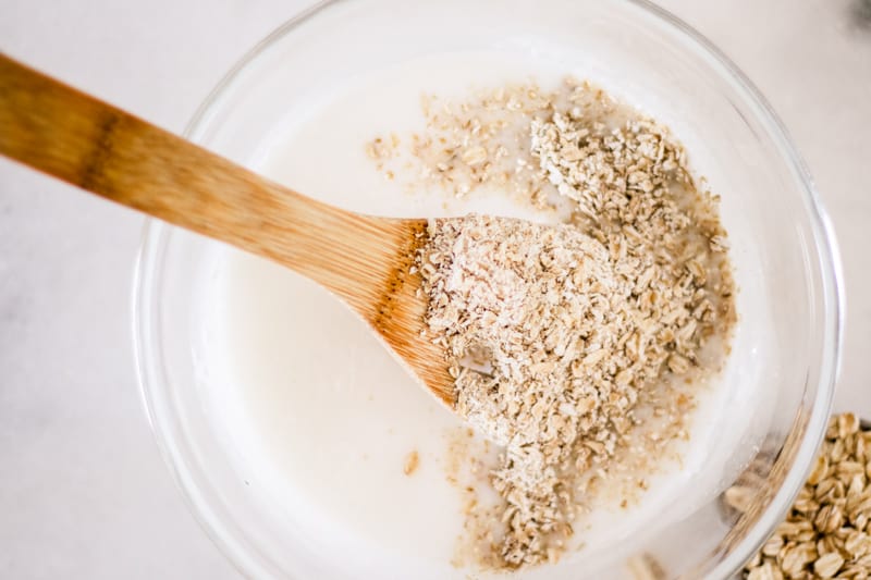 Stirring in the oatmeal, honey and lavender essential oil into the melted soap base.