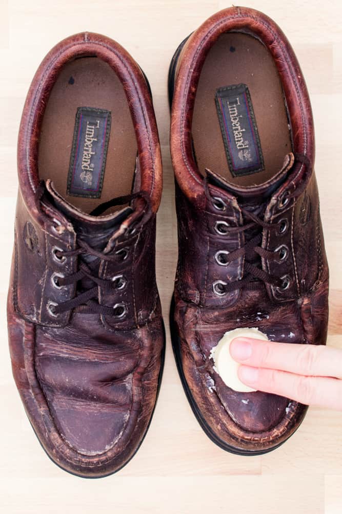 Wiping down leather dress shoes with homemade leather conditioner bar.