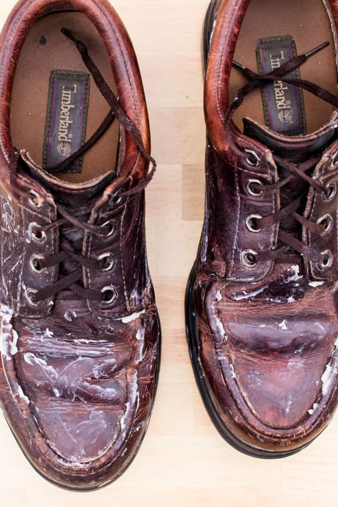 Brown leather dress shoes lathered in leather conditioner.