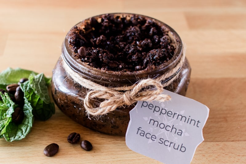 Homemade coffee face scrub on wood table. 