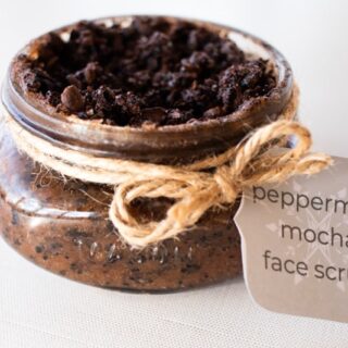 Peppermint mocha homemade face scrub in a decorative shallow glass jar with hemp cord and a recipe card.