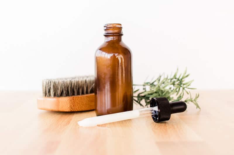 Making a bottle of anti-dandruff shampoo to prevent dry skin under the beard.