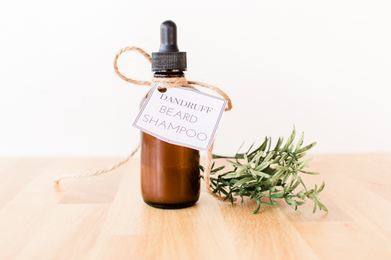 Homemade beard anti-dandruff shampoo in dropper bottle with printable label attached with hemp. 