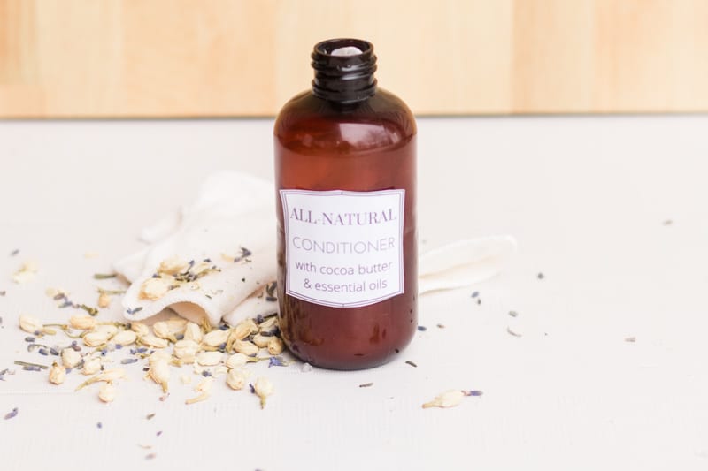 Homemade hair conditioner on marble vanity.