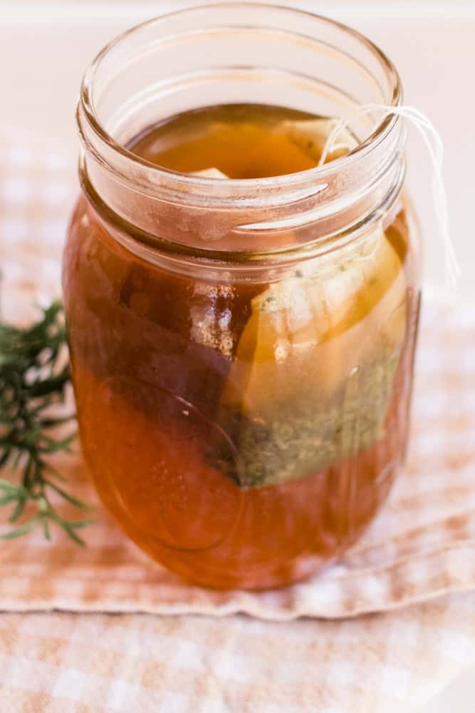 Green tea hair rinse in mason jar.