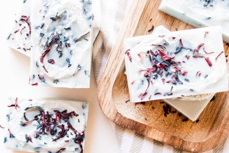 Homemade exfoliating soap bars with loofa pieces.