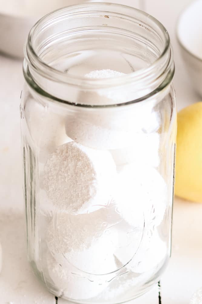 Homemade dishwasher tabs in a glass mason jar.