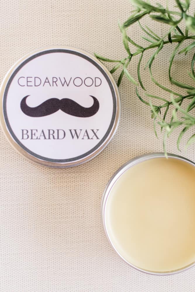 DIY beard wax with label in a small metal tin.