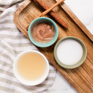 Natural hair lighteners on a wooden tray in small bowls