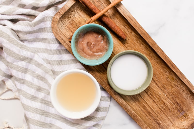 Natural hair lighteners on a wooden tray in small bowls