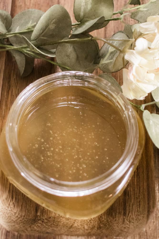 A DIY sugar wax cooling in a glass jar.