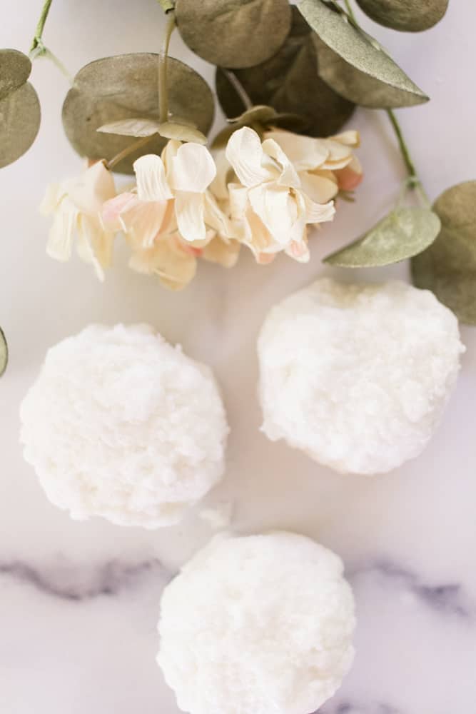 3 bath truffles with a flower close up.